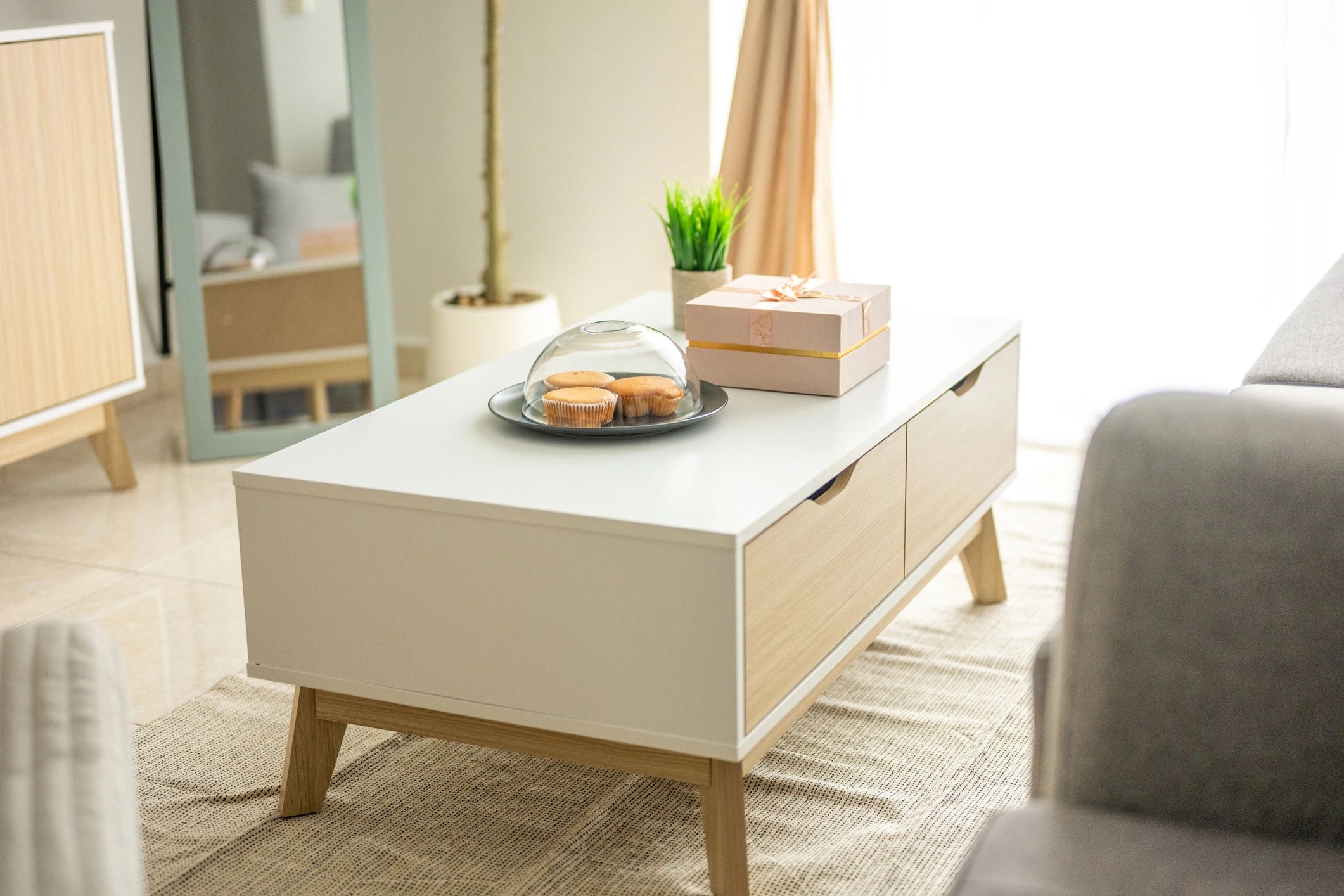 Modern living room with grey sofa and built-in cabinet
